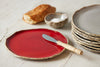 ceramic bread plate in red colour with butter knife