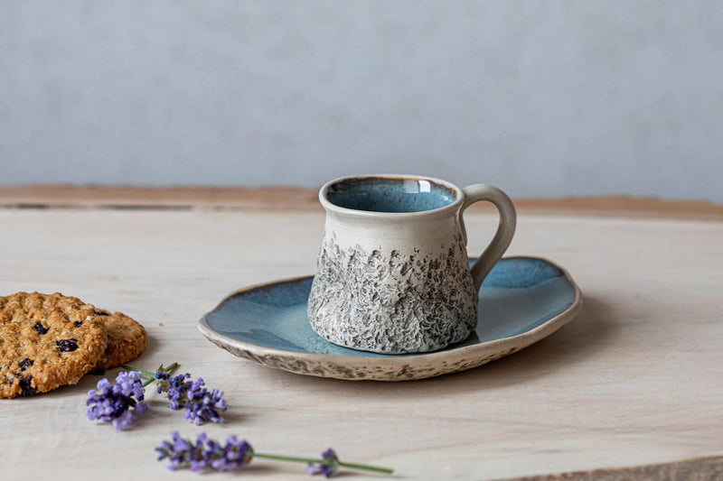 blue ceramic espresso cup with saucer