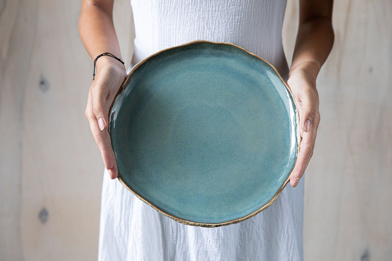 Handmade ceramic plates Ceramic pizza plates Large plate held in hands 